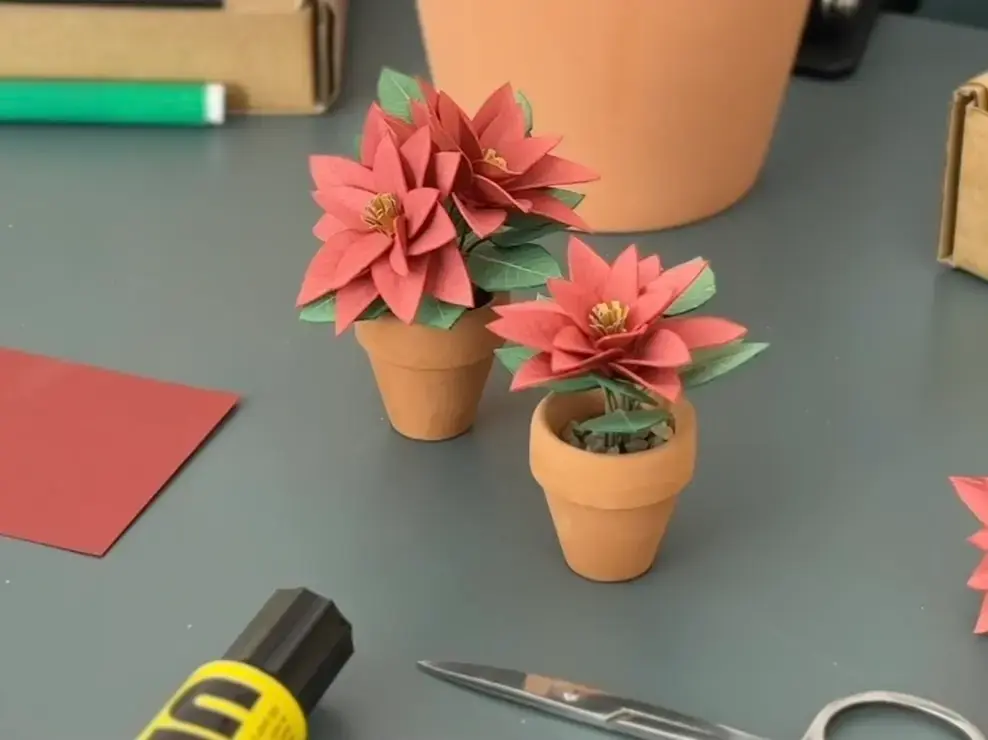 Handmade paper Poinsettia plants in single and double bloom styles